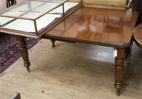 A late Victorian walnut extending dining table